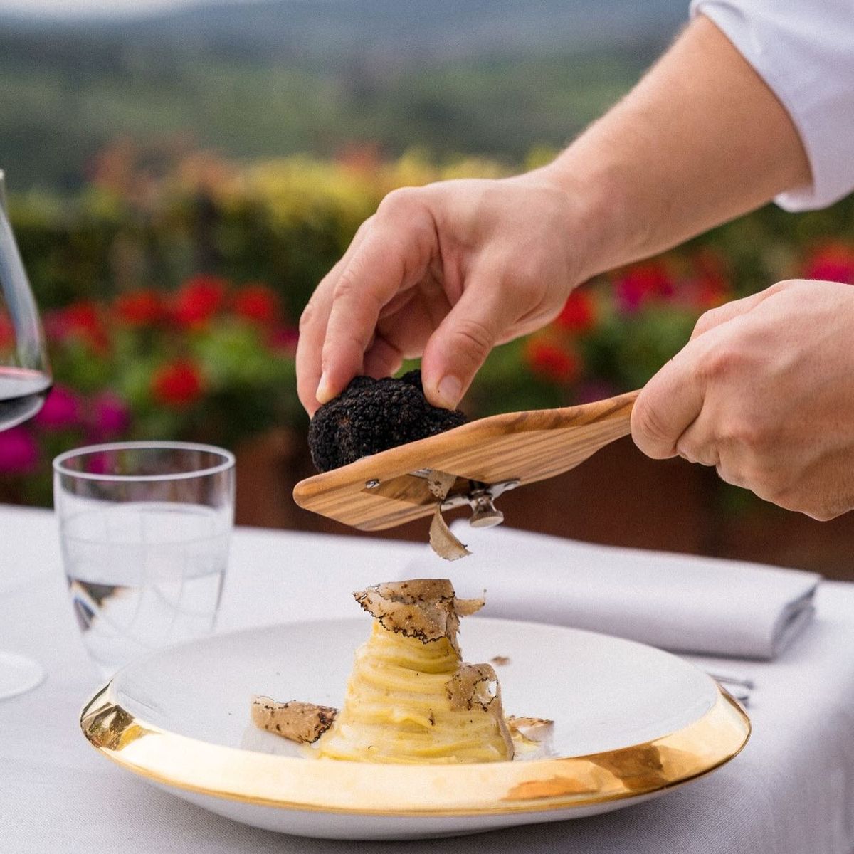 Black truffle shaved over handmade pasta — private Italian culinary experience